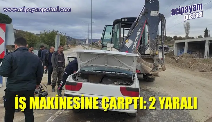 Otomobil geri manevra yapan iş
                    makinesine çarptı: 2 yaralı